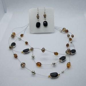 Multilayered necklace in black, silver and brown colors